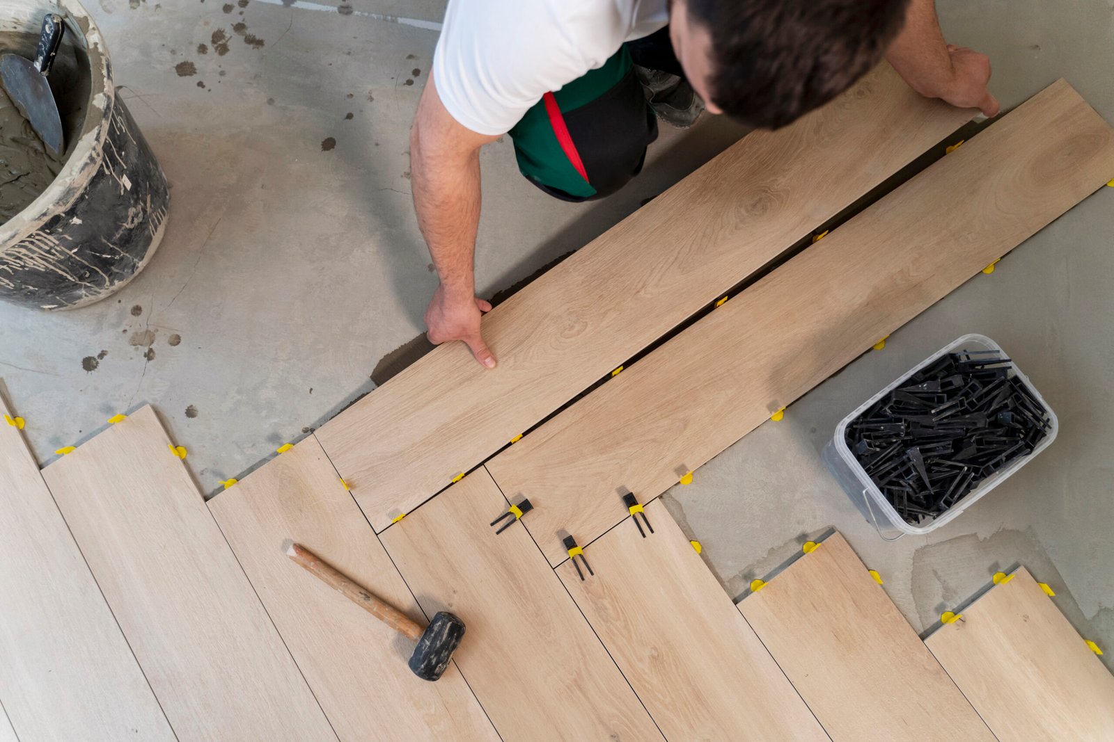 man arranging floor tiles
