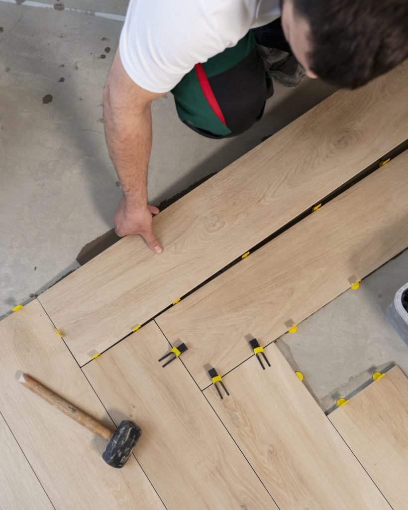 man arranging floor tiles